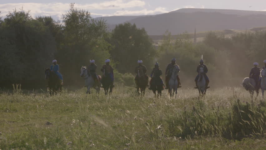 Armored archers on horse, coming from far somewhere, soldiers, cavalry