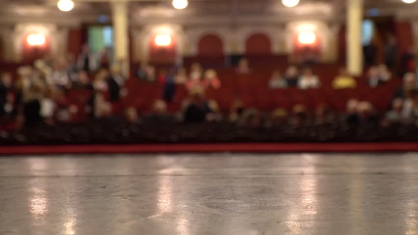 Theater stage, podium and defocused image of the auditorium. Place for text. Copy space.