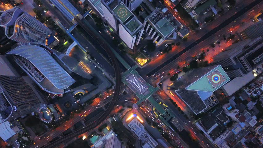 Time lapse of aerial view of Sathorn intersection or junction with cars traffic, Bangkok Downtown, Thailand. Financial district and business area. Smart urban city. Skyscraper and buildings at night. | Shutterstock HD Video #1026614675