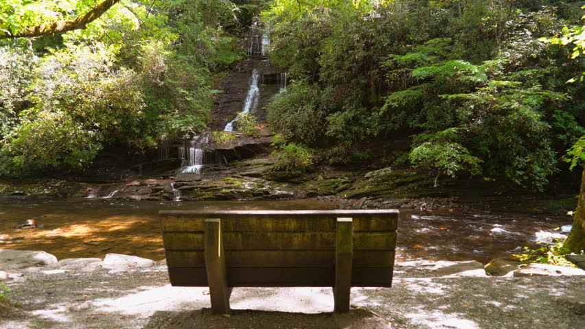 A wooden bench faces Tom Branch that provide the perfect opportunity to sit a while and enjoy the view in the Deep Creek Area of the Great Smoky Mountains National Park, near Bryson City, NC.