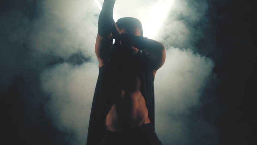 Sexy man dancing in smoke