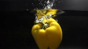 Yellow Pepper Falling in Water with Splash in Slow Motion - Powered by Shutterstock - Get 15% off with code: PIKWIZARD15