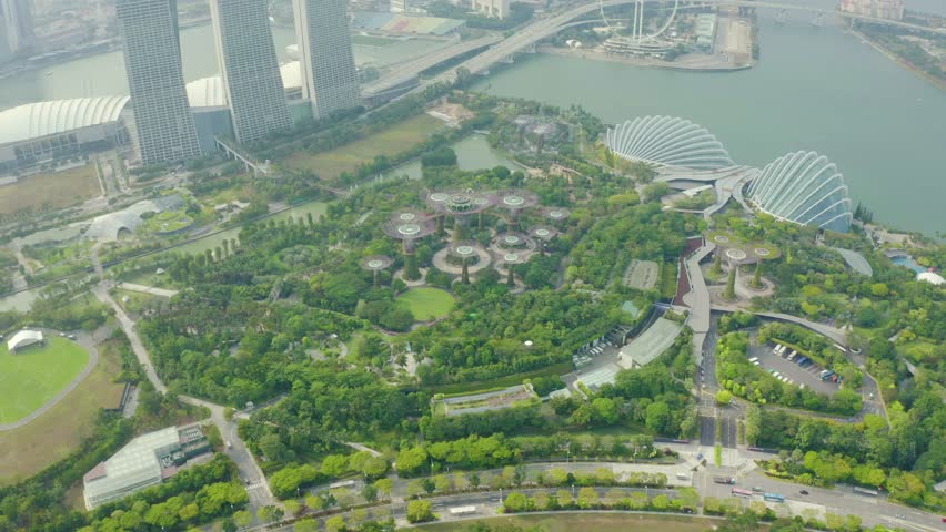 Drone Aerial view 4k Footage Of Gardens By The Bay, Flying Towards Skyline Singapore. Marina Bay In Singapore.