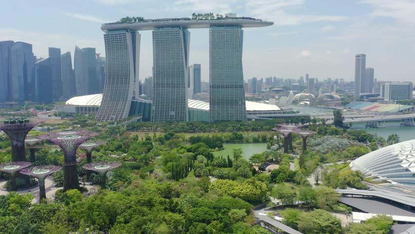 Drone Aerial view 4k Footage Of Gardens By The Bay, Flying Towards Skyline Singapore. Marina Bay In Singapore. Royalty-Free Stock Footage #1026628556