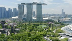 Drone Aerial view 4k Footage Of Gardens By The Bay, Flying Towards Skyline Singapore. Marina Bay In Singapore.
