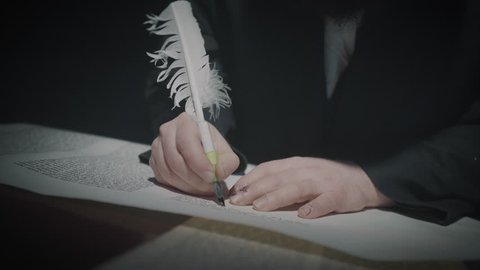 Cinematic shot of the man writing a Torah scroll