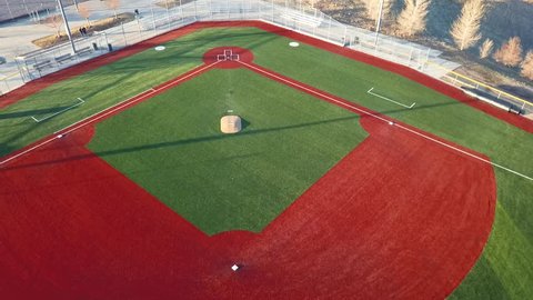 CASTLE ROCK, COLORADO/USA - MARCH 28 2019: Aerial drone video in the early morning of a freshly prepared local park baseball field ready for baseball opening day play.