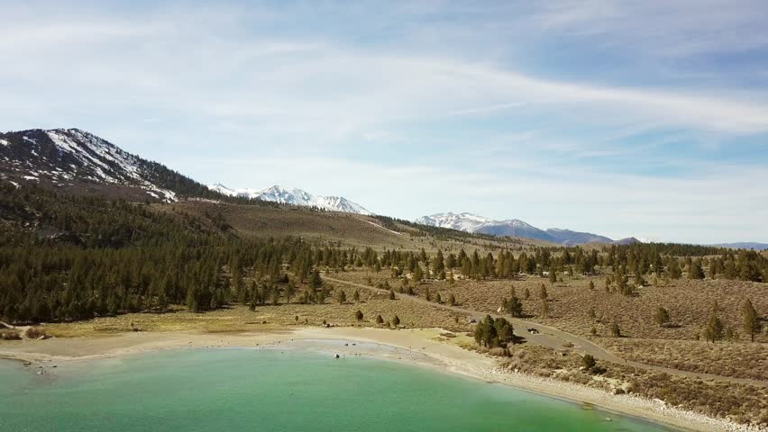 Aerial pan towards the campground at June Lake in California. Camping and Exploring concept.