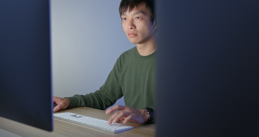 Man work on computer at night