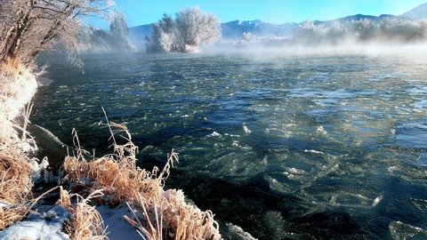 Icy Frost Rising From The Madison River In Ennis Montana On Cold Winter Day