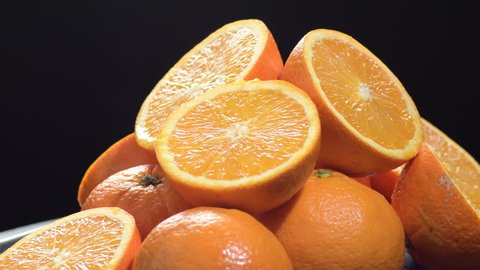 Oranges fruit cut in half gyrating