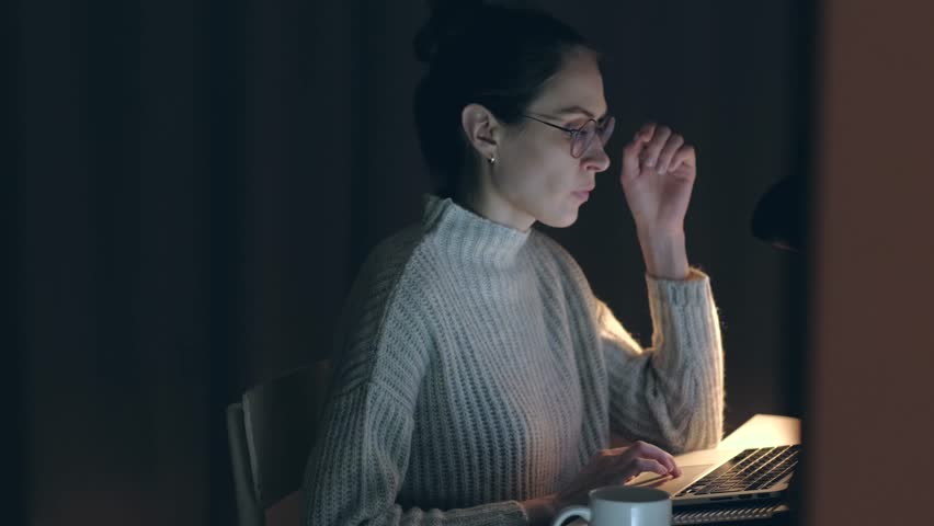 Beautiful Woman takes off his glasses and rubbing tired eyes. Female yawn and want to sleep. Problem with glasses, eyesight or vision. Working late with computer. Astigmatism, myopia or insomnia. Royalty-Free Stock Footage #1026688349