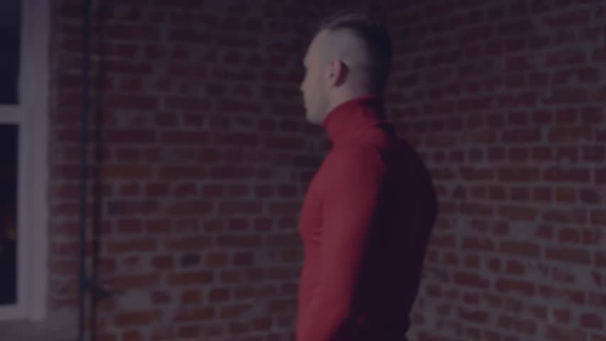 the man turns to the camera