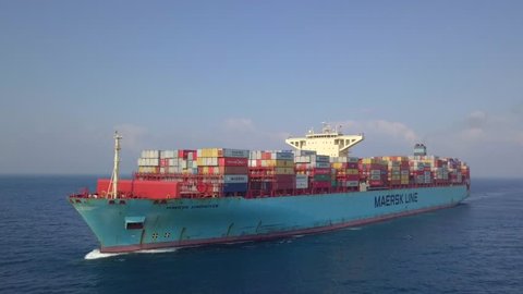 Maersk Eindhoven Ultra large container vessel (ULCV 366 Meters long) loaded with various Container brands, at sea - Aerial footage.