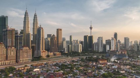 KUALA LUMPUR, Malaysia - March 31st 2019 : Time lapse : Beautiful cityscapes architecture view at capital city of Malaysia from evening to blue hours. 4K resolution. Zoom out motion timelapse