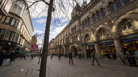 Glasgow, Scotland,United Kingdom October 21st 2018: Buchanan Street dynamic time lapse showing bustling city center with old architecture and people walking past an array of retail stores.