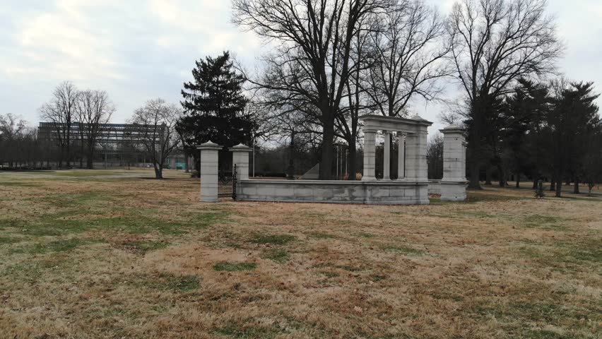 Low, aerial shot moving around a structure in Forest Park; St. Louis, Missouri.