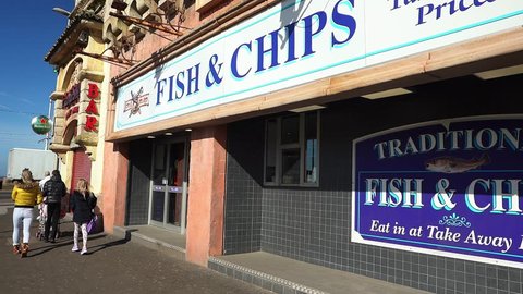 Blackpool, Lancashire - 25th March 2019 - A classic British, English fish and chip shop on the high street in the city centre of Blackpool a famous tourist, holiday location, traditional fast food 
