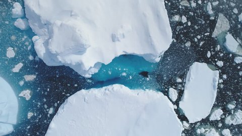 Antarctica Iceberg Ocean Seascape Aerial View. Wildlife North Polar Sea Motion Scenery Climate Change Concept. Majestic Actic Deep Clear Water Surface Scene Top Down Drone Overview Footage 4K (UHD)