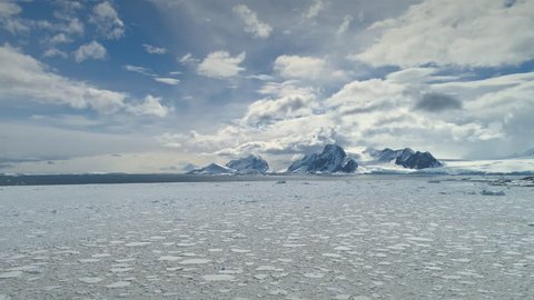 Antarctica Timelapse. Snow Iceberg Drift Wild Nature Aerial View. Epic Glacier Surface Landscape. Frozen Antarctic Climate Change Pole Continent Scenery Drone Hyperlapse Overview Shot Footage 4K (UHD)