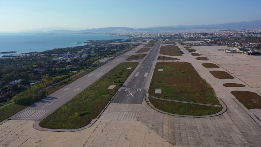 Aerial drone video of old and abandoned no longer in use former National Airport of Athens Elliniko in South Athens, Attica, Greece