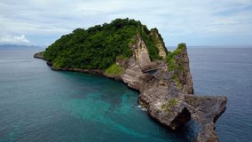 Drone aerial view of beautiful limestones cliff and seascape on Nusa Penida Island, Bali . High angle drone shot of spectacular nature in Indonesia 