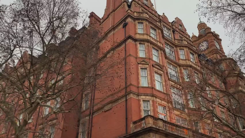 Driving by random building in london with a clock