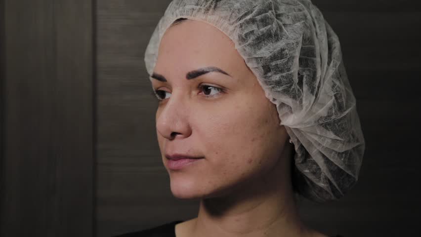 Beautiful woman after vacuum cleaning of the face, cheerful mood.