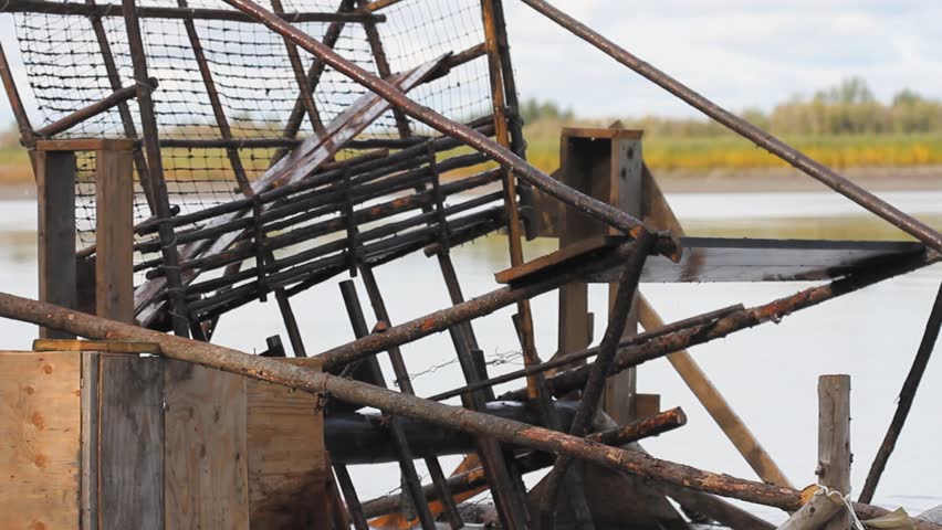 Yukon River, Yukon Territories, Alaska. Close up of wood salmon fishing wheel in the Yukon River.