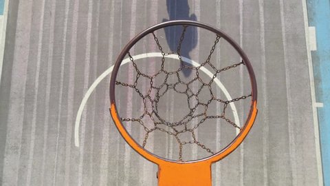 A basketball outdoors hoop in a park