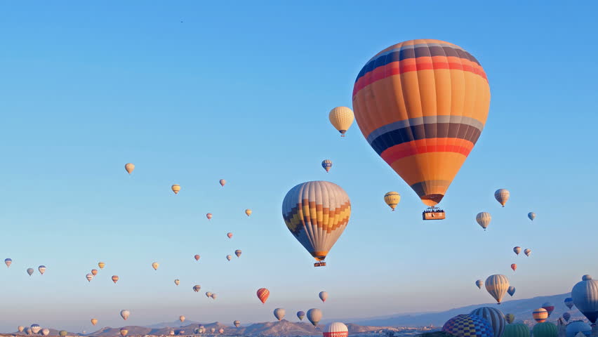 hot-air balloons flying over the mountain landsape of Cappadocia,Turkey. Royalty-Free Stock Footage #1026792218
