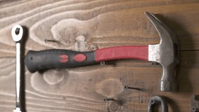 A demonstration video of a craftsman taking a hammer and putting it on its place.