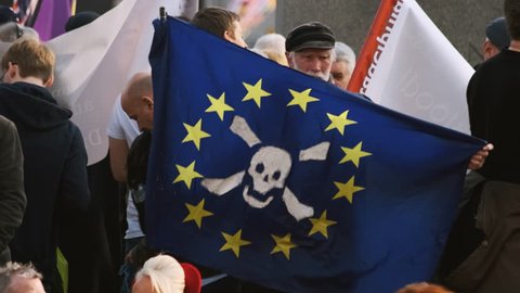 LONDON, 29 March 2019 - Slow motion shot of a BREXIT demonstrator holding a EU flag with a skull and crossbones on the day the UK failed to leave the EU as originally planned - 29th March 2019