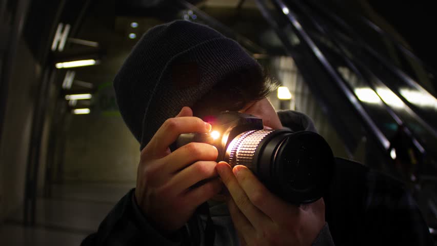 Young Man Taking A Photo With Flash
