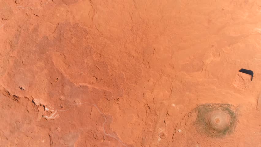 MONUMENT VALLEY, ARIZONA, USA. Top aerial 4K view of the sandstone tower across the reddish landscape. Exploring the incredible landscapes of Monument Valley.