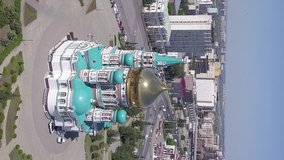 Vertical video. The Cathedral of the Assumption of the Blessed Virgin Mary, panoramic views of the city. Omsk, Russia, From Drone, Point of interest