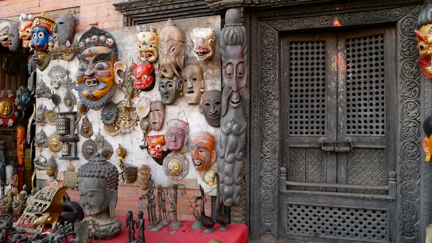 Traditional colorful Handmade wooden masks and handicrafts for sale in Kathmandu, Nepal. Souvenir Shops in Durbar of Bhaktapur and Patan. Swayambhunath decorative asian market.