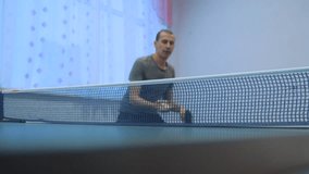 table tennis forehand concept. slow motion video. lifestyle blurred focus man playing training table tennis the sport active