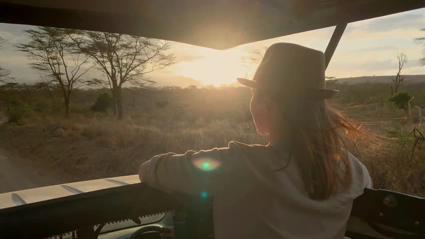 Woman on a safari trip in Masai Mara park, Kenya Royalty-Free Stock Footage #1026844208