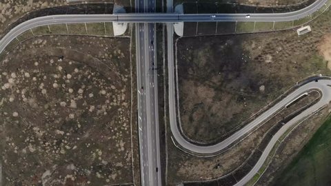 aerial top view of light traffic on highway, 2 lanes, DRONE FOOTAGE
zoom out