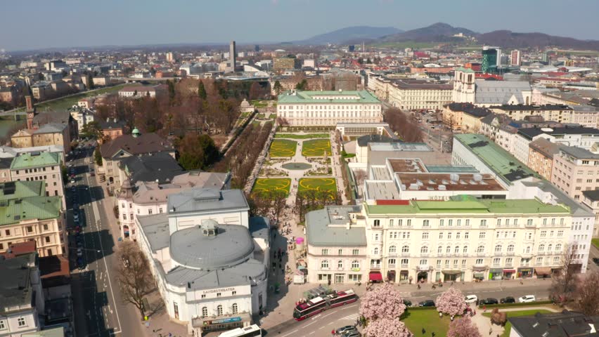 Aerial view of famous Mirabell Gardens with historic Hohensalzburg Fortress in the background on a sunny day in fall in Salzburg, Austria