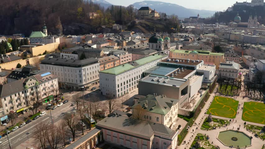 Aerial view of famous Mirabell Gardens with historic Hohensalzburg Fortress in the background on a sunny day in fall in Salzburg, Austria