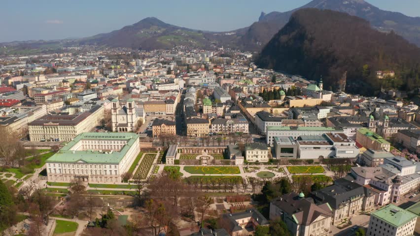 Aerial view of famous Mirabell Gardens with historic Hohensalzburg Fortress in the background on a sunny day in fall in Salzburg, Austria