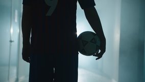Soccer player walking from locker room to soccer stadium - Powered by Shutterstock - Get 15% off with code: PIKWIZARD15