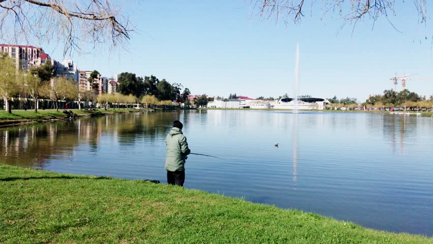 Fisherman on the city lake