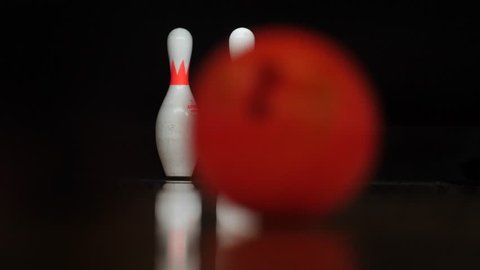 Bowling Playing Competition and recreation. In pin bowling, the goal is to knock over pins at the end of a lane, with either two or three balls per frame allowed to knock down all pins.