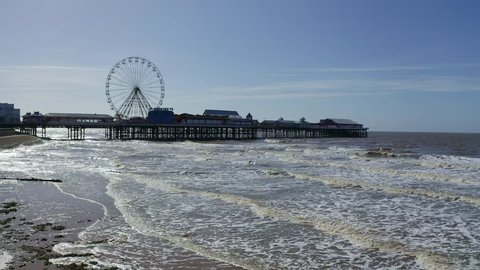 Stunning aerial view of the famous Blackpool pier at high tide, by the award winning Blackpool beach, A very popular seaside tourist location in England , United Kingdom, UK