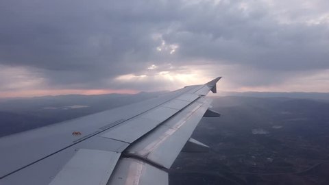 Airplane flying, view from passenger seat through window