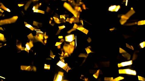 Ultra HD - 4K Realistic Golden Confetti, Party Popper on a Black Background .  Super Slow Motion , Realistic Video Background ... You can use blending mode (screen).