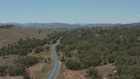 Australian outback drone POV looking down highway in country New South Wales